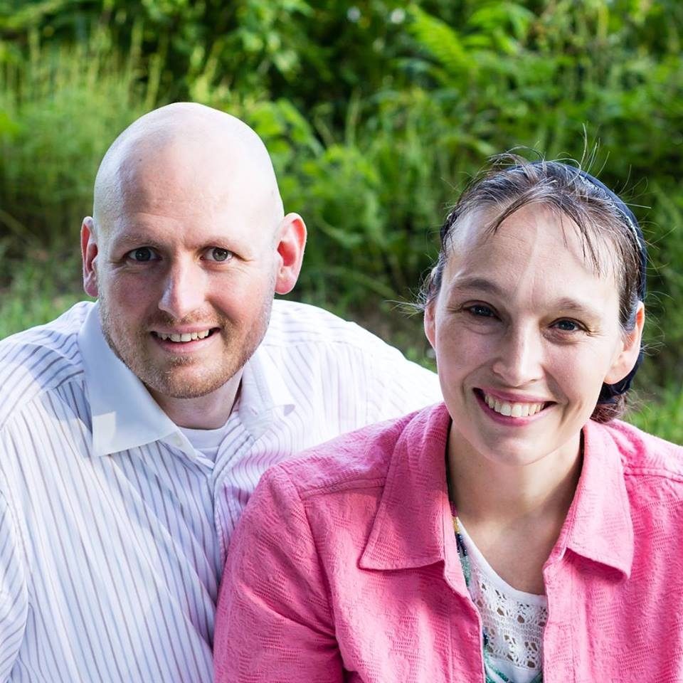 Israel and Brook Wayne outdoors, smiling